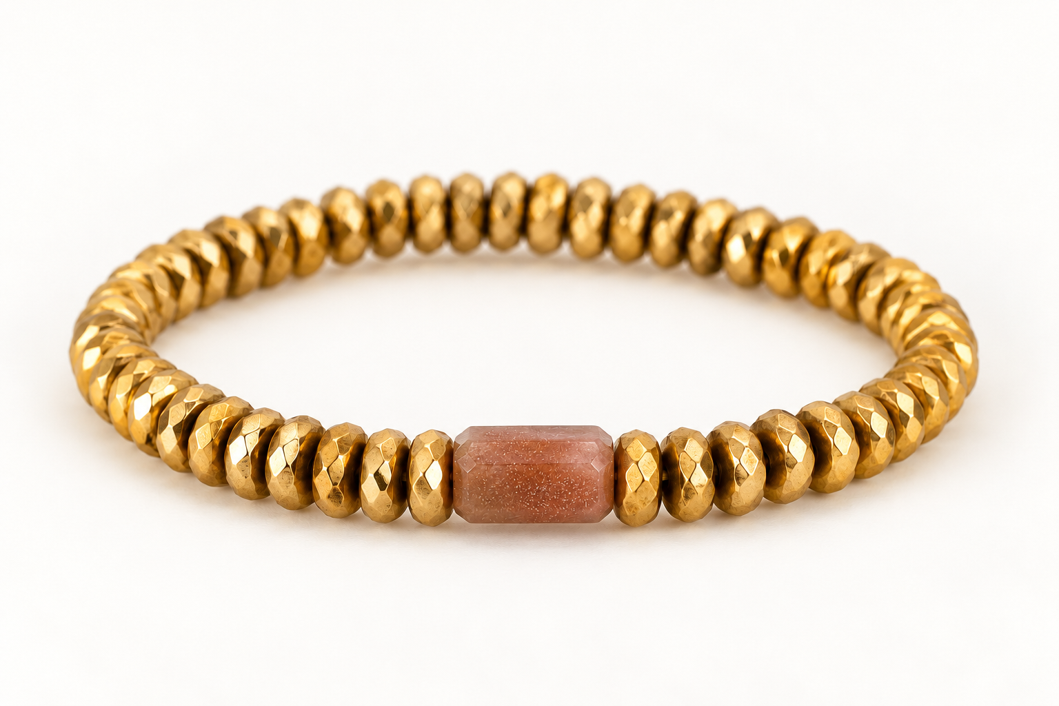 Gilded Light Bracelet, faceted gold-dipped Hematite with a single elongated Peach Moonstone