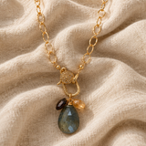 Coastal Cluster Talisman resting on soft flax linen
